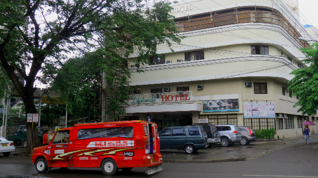 A jeepney, a typical type of public transportation goes by the Diplomat Hotel