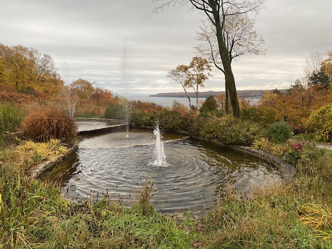 A fountain can be seen on the grounds and a trail leads to the bay.