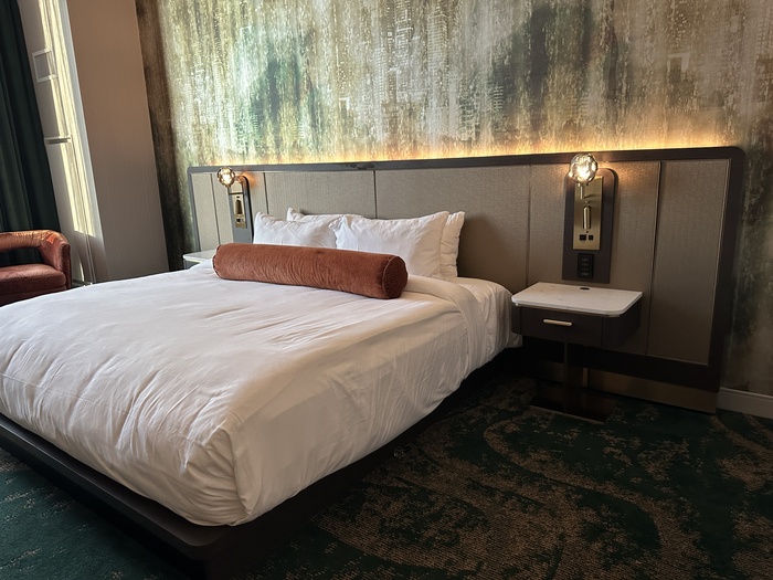 Bed with pillows on it.