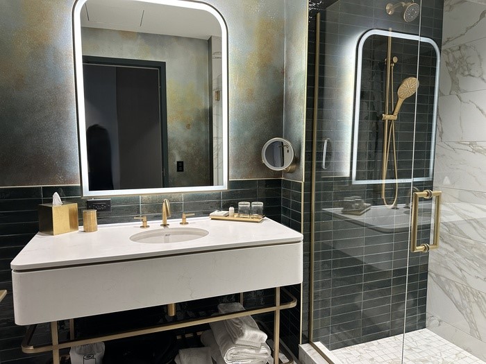 A sink beside the shower.