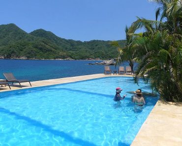 swimming pool with a view of the mountains